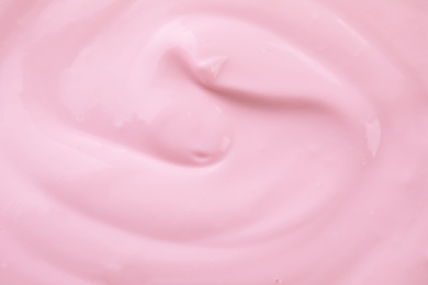 Delicious creamy yogurt as background, closeup view