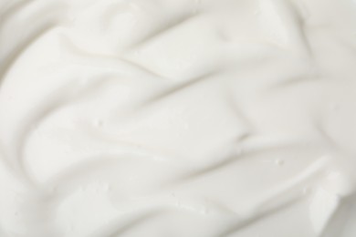 Photo of Delicious natural yogurt as background, top view