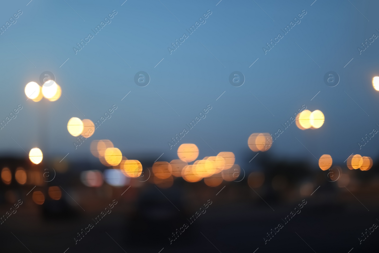 Photo of Blurred view of beautiful city in evening