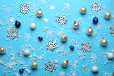 Photo of Flat lay composition with Christmas decorations on blue background. Winter season