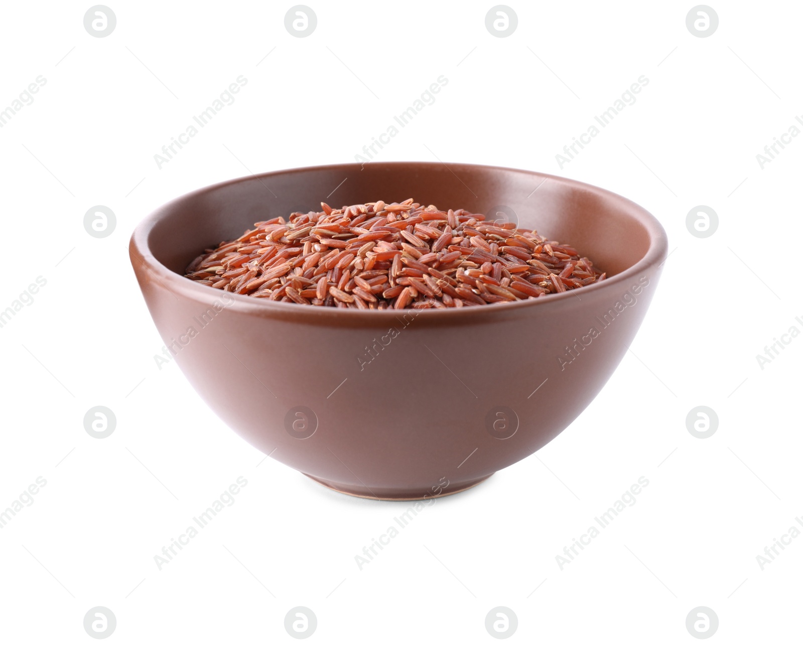 Photo of Uncooked brown rice in bowl isolated on white