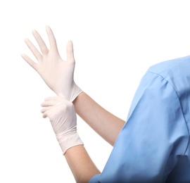 Photo of Female doctor putting on rubber gloves against white background, closeup. Medical object