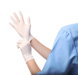 Female doctor putting on rubber gloves against white background, closeup. Medical object