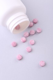 Photo of Jar with vitamin pills on white background, flat lay