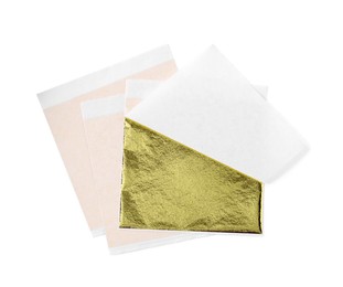 Many edible gold leaf sheets on white background, top view