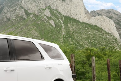 Photo of Beautiful view of mountains and car outdoors. Road trip