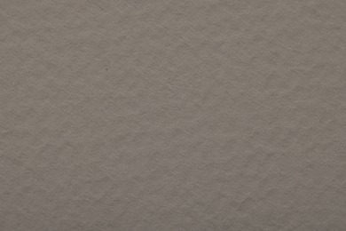 Photo of Texture of grey paper sheet as background, top view