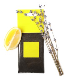Photo of Scented sachet, lemon and dried lavender on white background, top view