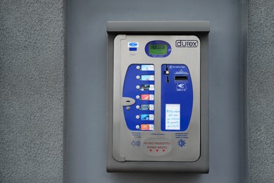 Photo of Ripe (AN), Marche, Italy – APRIL 07, 2022: Durex condom vending machine on grey wall