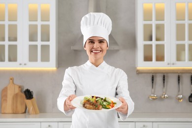 Photo of Portrait of professional chef presenting delicious dish in kitchen