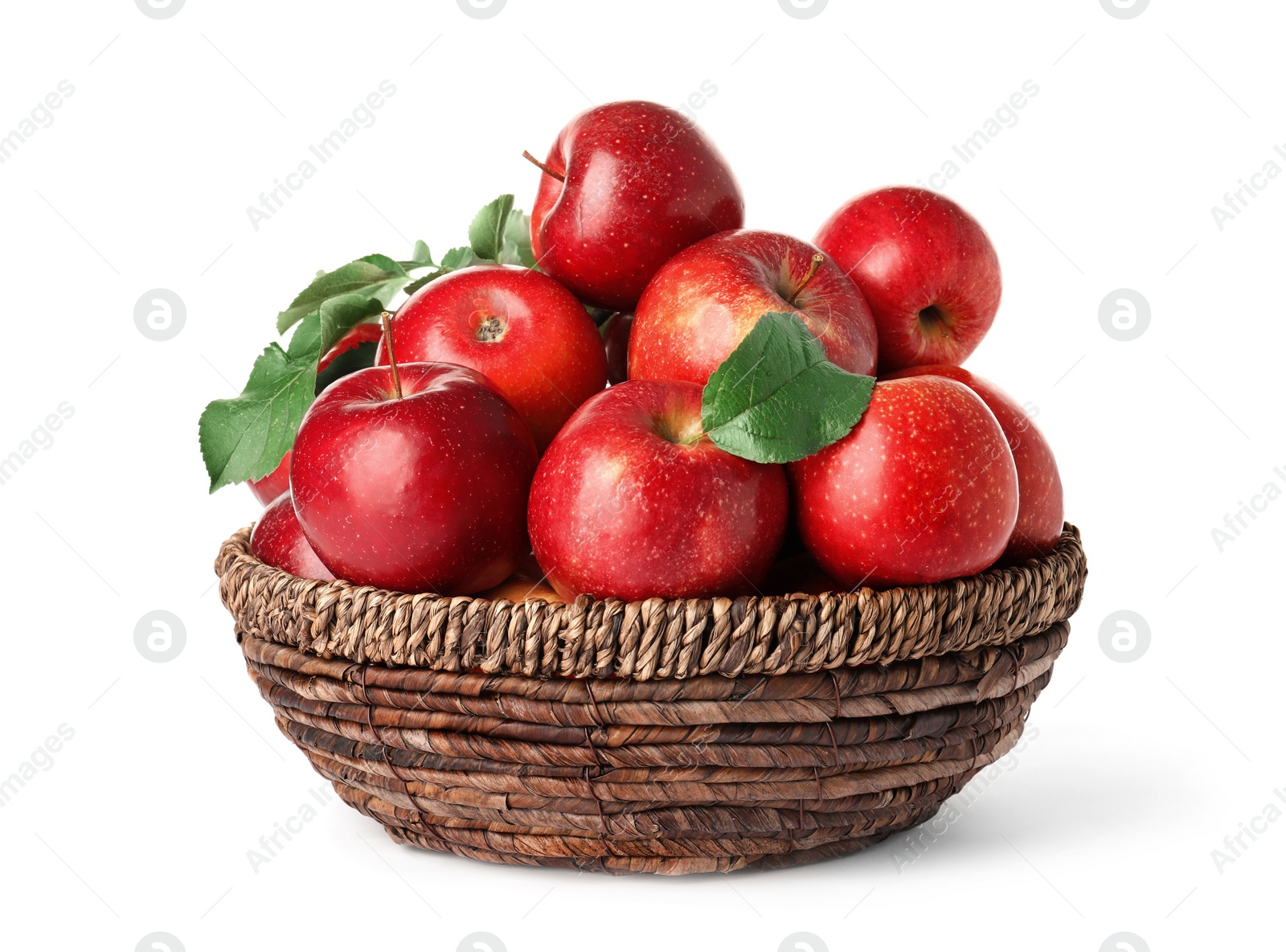 Photo of Juicy red apples in wicker basket on white background