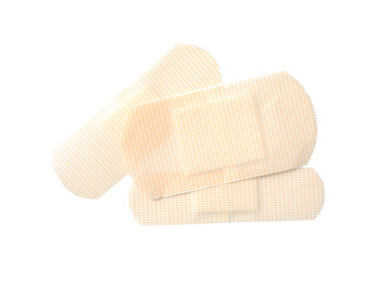 Photo of Medical sticking plasters isolated on white. First aid item