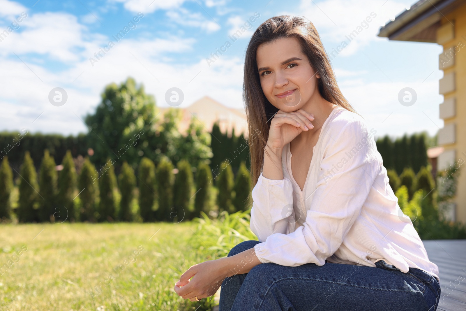 Photo of Portrait of beautiful young woman at backyard, space for text