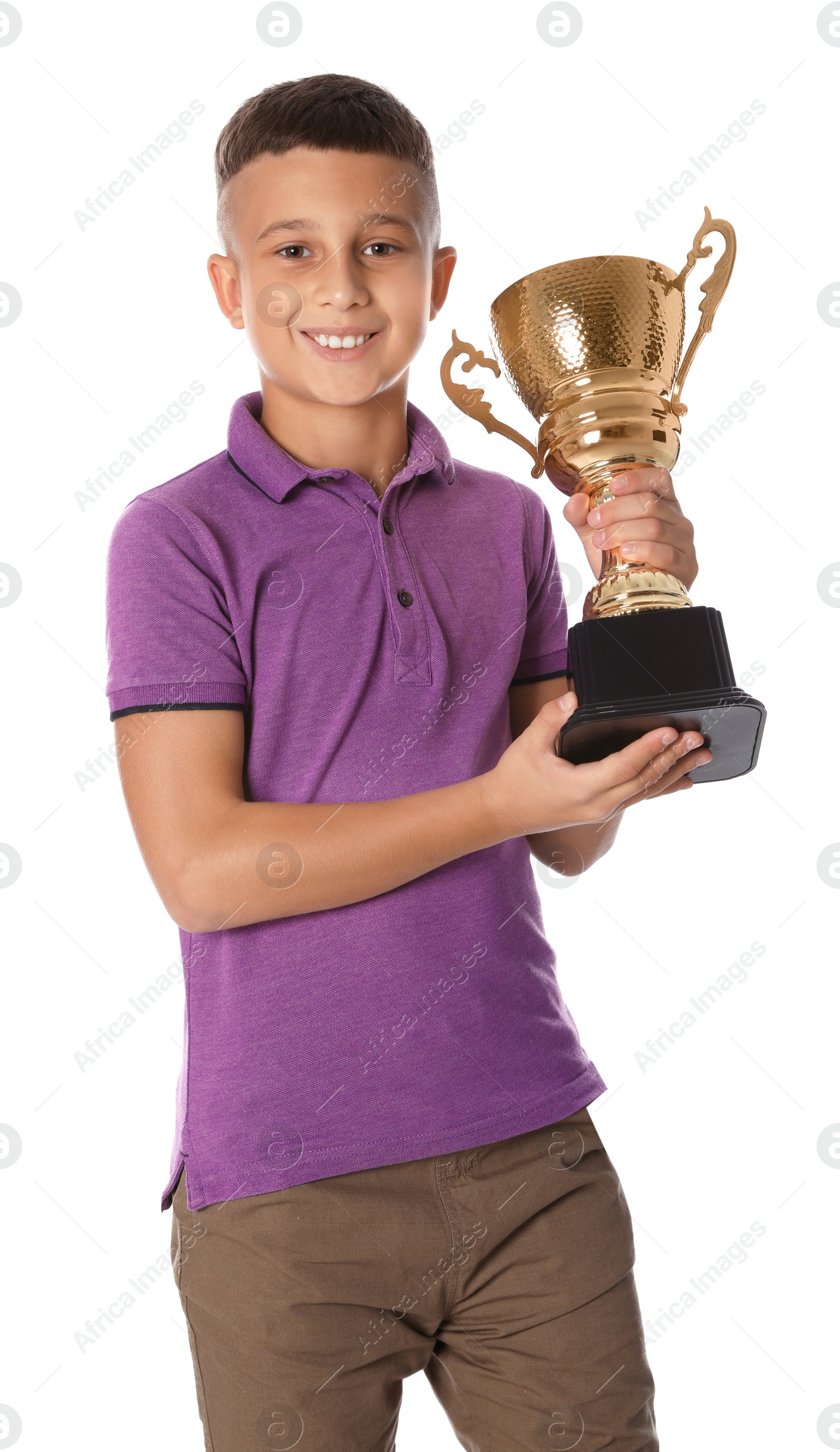 Photo of Happy boy with golden winning cup on white background