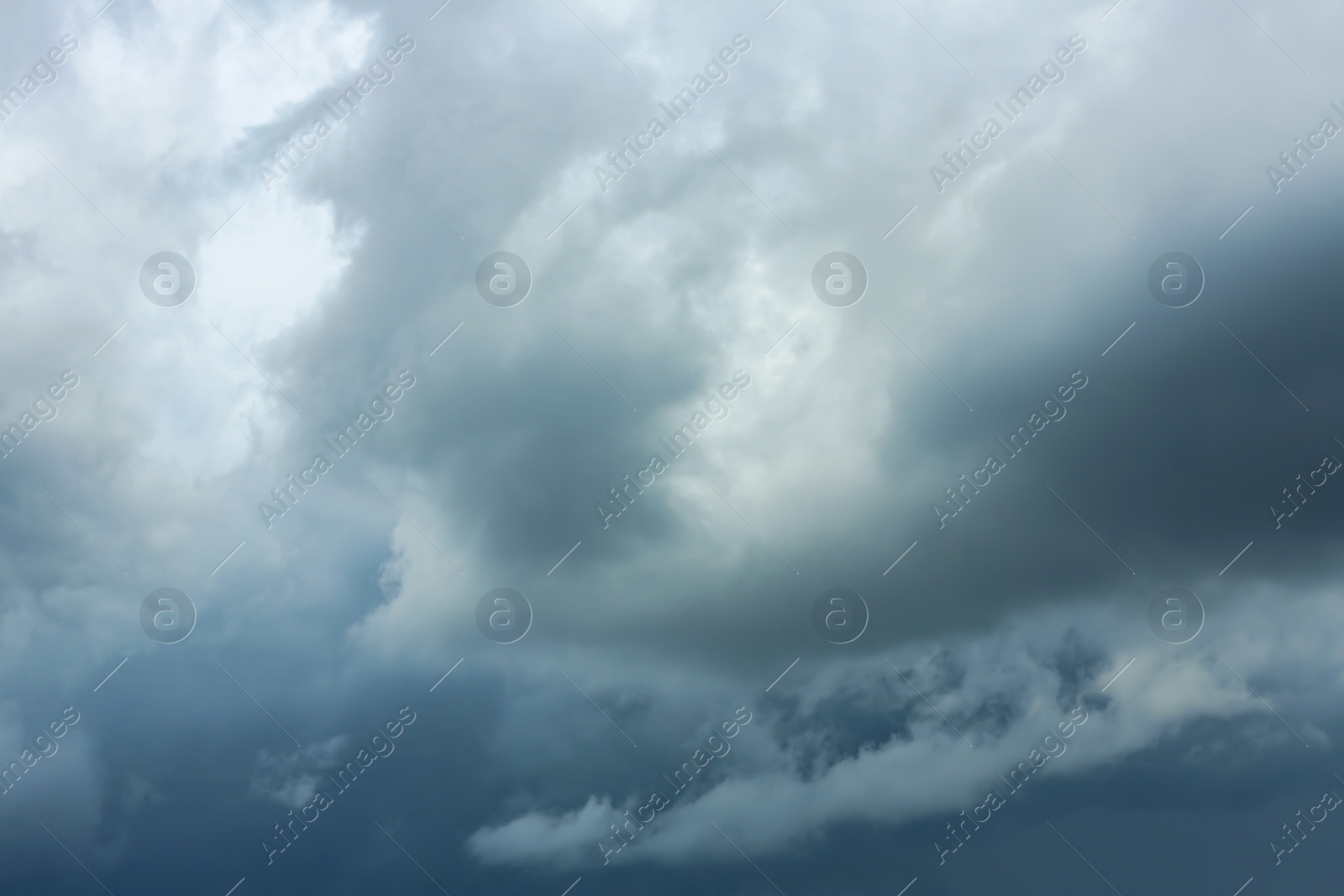 Photo of Sky with heavy rainy clouds on grey day