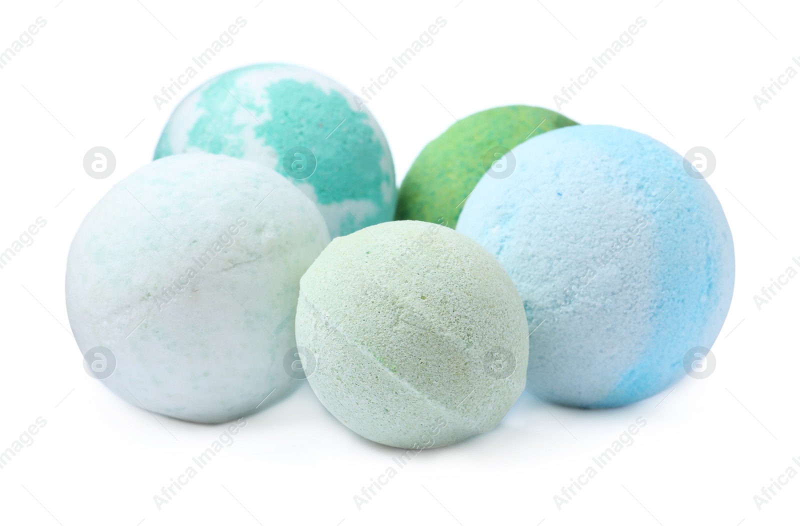 Photo of Many colorful bath bombs on white background