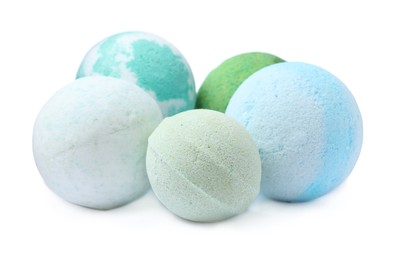 Photo of Many colorful bath bombs on white background