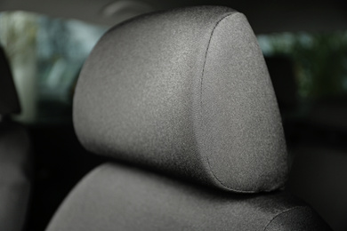 Photo of Car seat with grey upholstery, closeup view