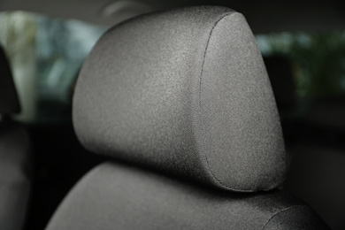 Car seat with grey upholstery, closeup view