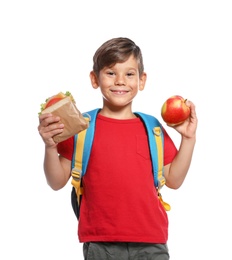 Photo of Schoolboy with healthy food and backpack on white background