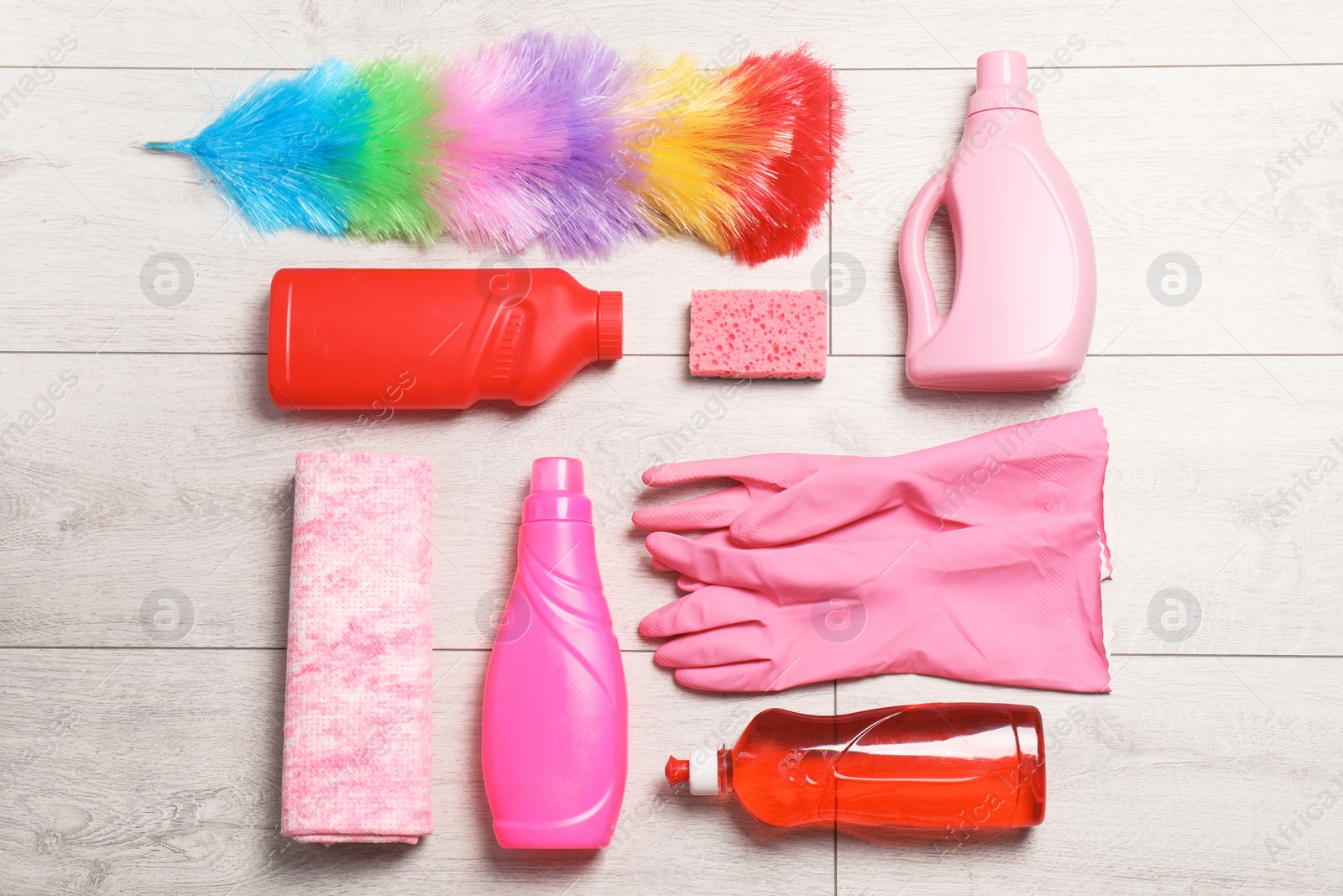 Photo of Flat lay composition with cleaning supplies on wooden background