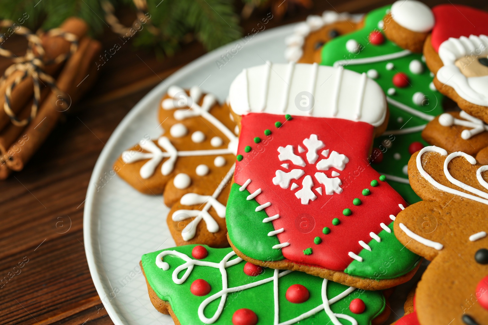 Photo of Different tasty Christmas cookies on wooden table, closeup. Space for text