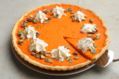 Delicious homemade pumpkin pie on light table