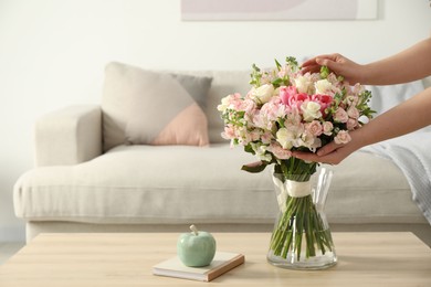 Photo of Woman with beautiful bouquet of fresh flowers at home, closeup. Space for text