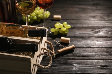 Crates with bottles of wine on wooden table