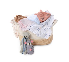 Photo of Laundry basket with baby clothes and soft toys isolated on white