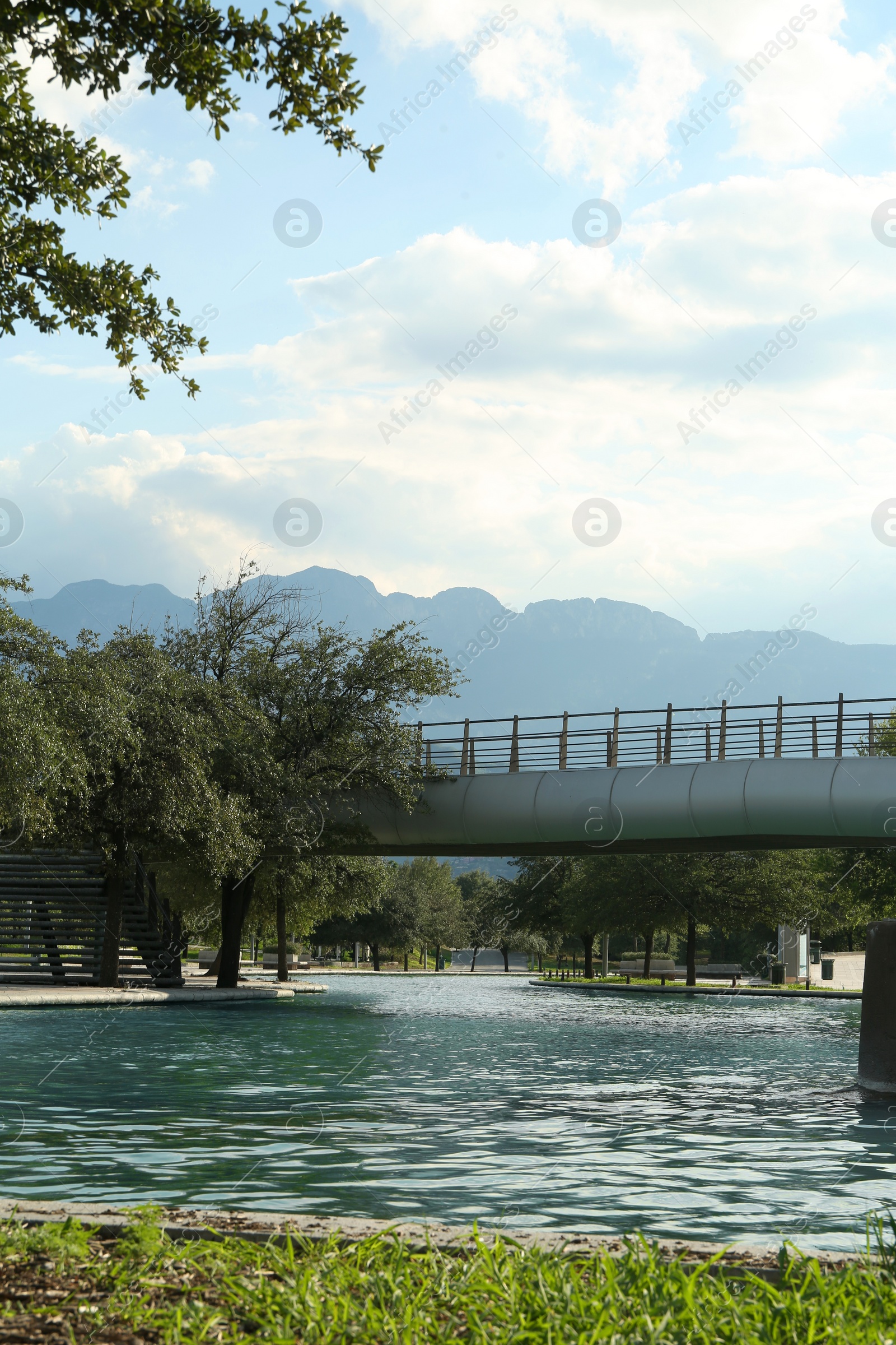 Photo of Beautiful view of modern bridge over canal in park