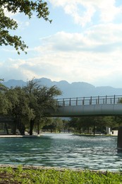 Beautiful view of modern bridge over canal in park