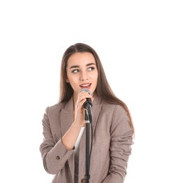 Photo of Young stylish woman singing in microphone on white background