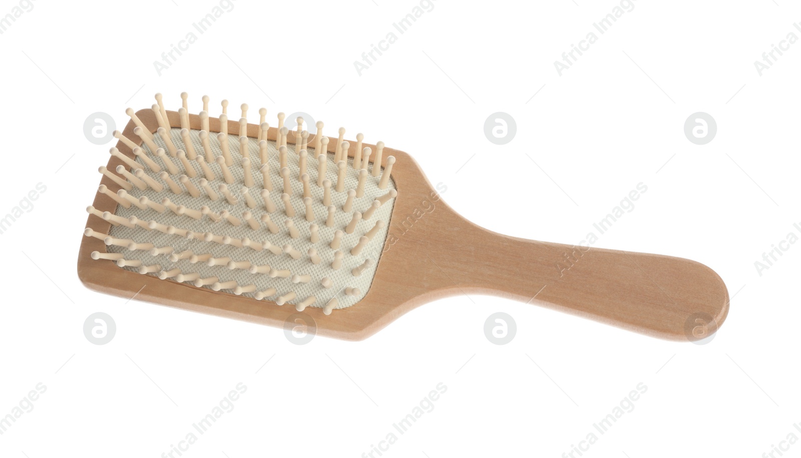 Photo of New wooden hair brush isolated on white