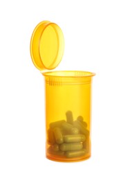 Photo of Plastic container with many pills isolated on white