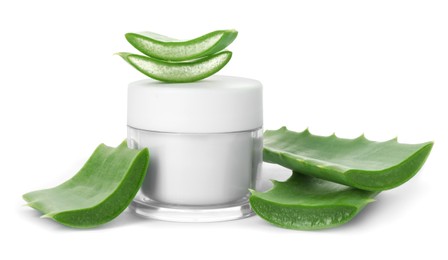 Photo of Jar of natural cream and cut aloe leaves isolated on white