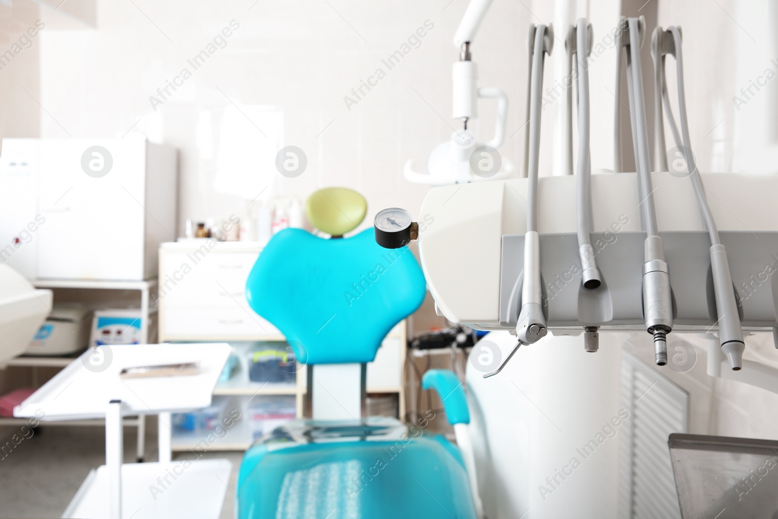 Photo of Set of professional instruments in dentist's office