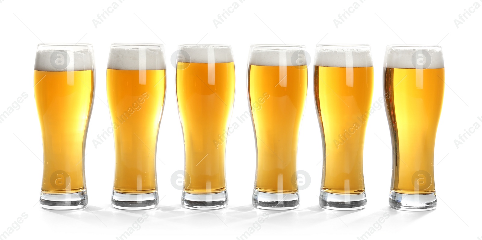 Photo of Glasses of beer on white background