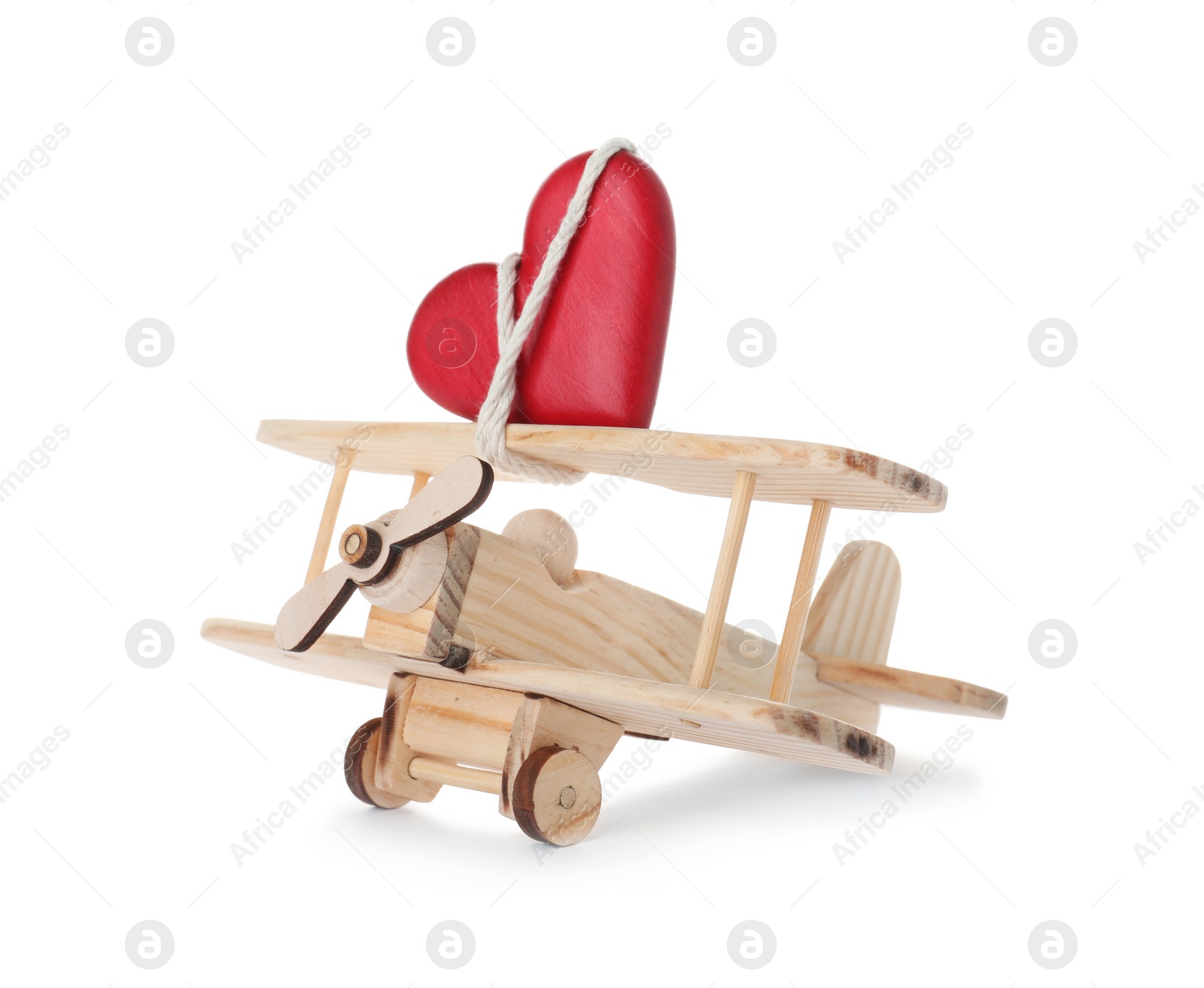 Photo of Toy plane with red heart on white background