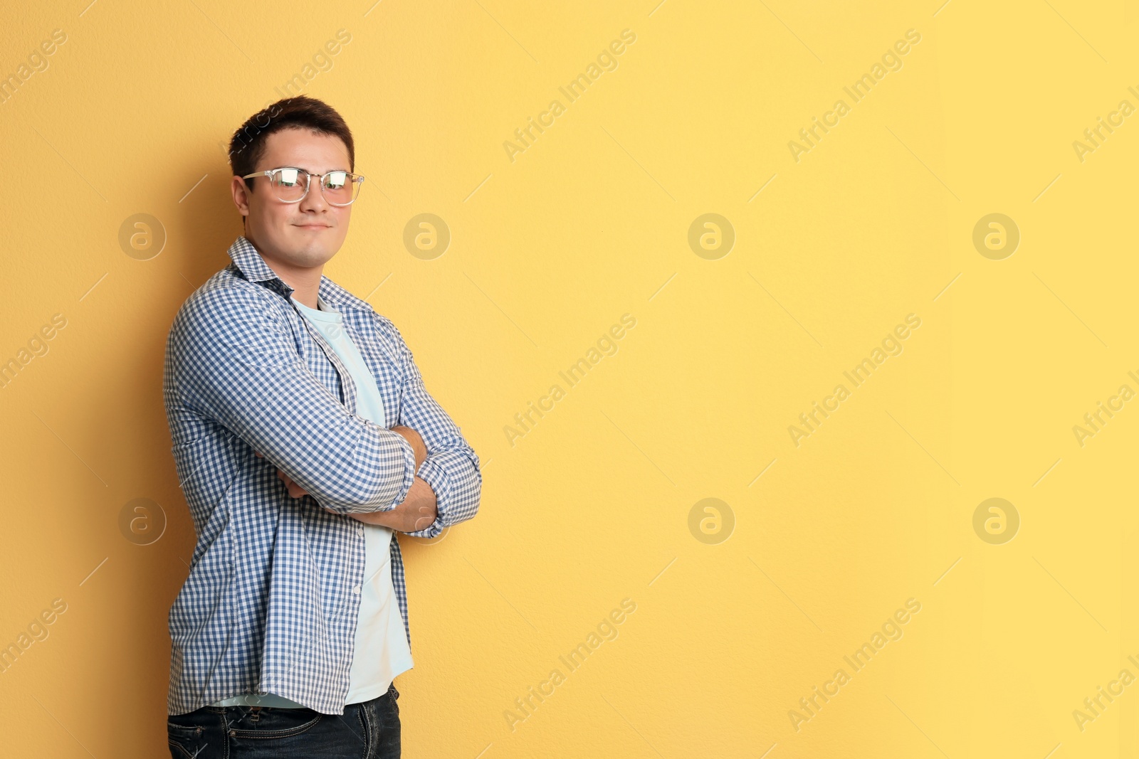 Photo of Portrait of confident young man on color background