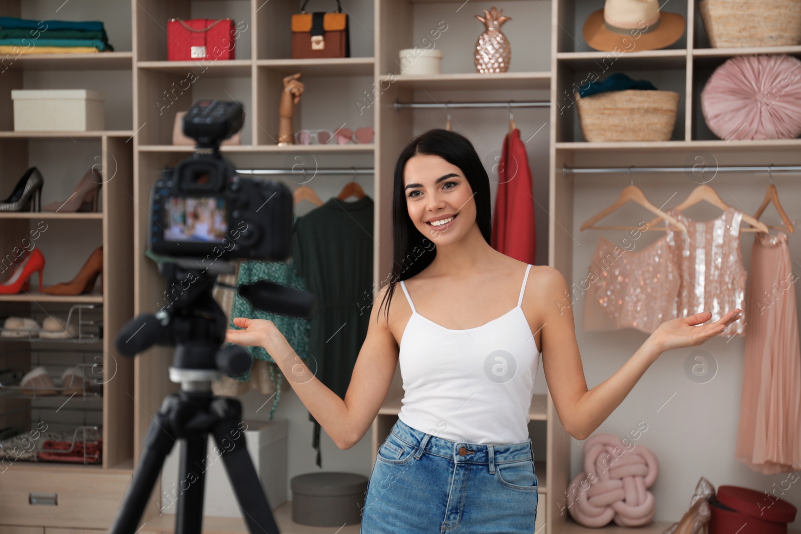 Photo of Fashion blogger recording new video in room