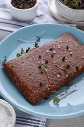 Fresh raw vegan mince with spices on table, closeup