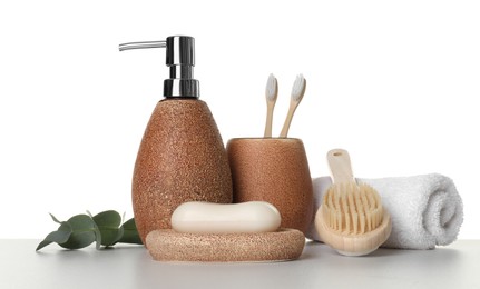 Bath accessories. Different personal care products and eucalyptus branch on table against white background