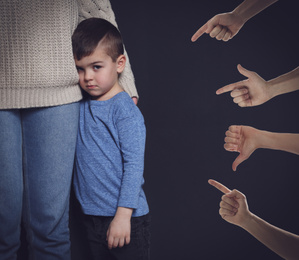 Image of People bullying little boy on black background