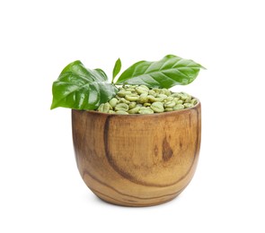 Photo of Wooden bowl with green coffee beans and fresh leaves on white background