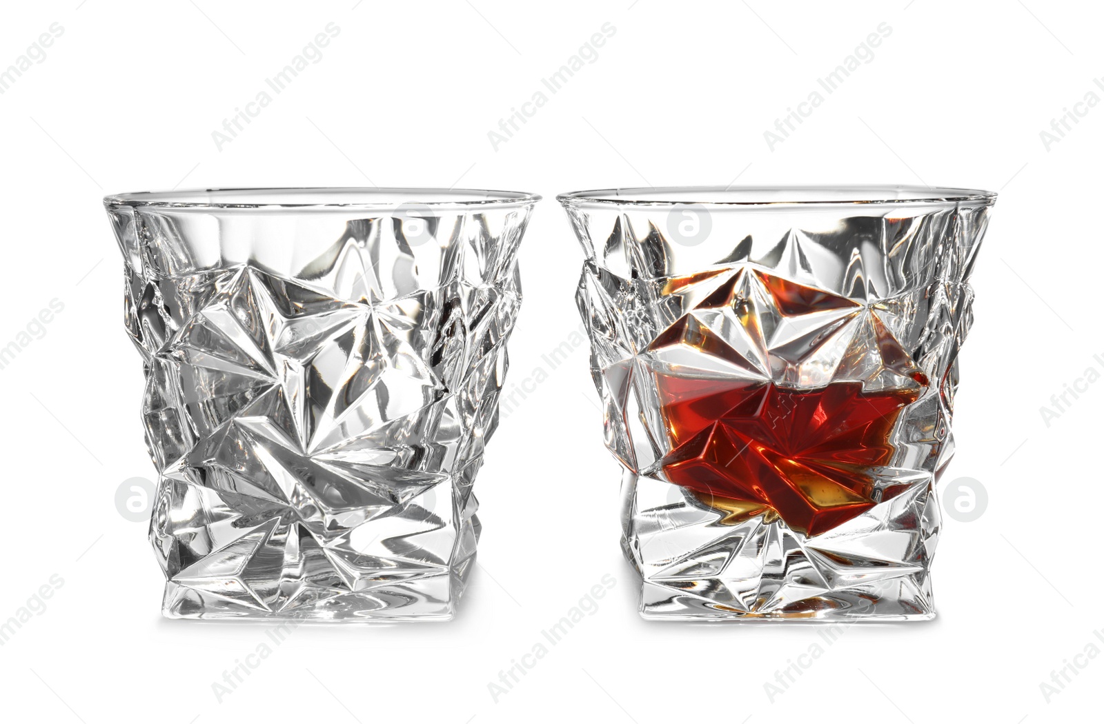 Photo of Empty and full whiskey glasses on white background