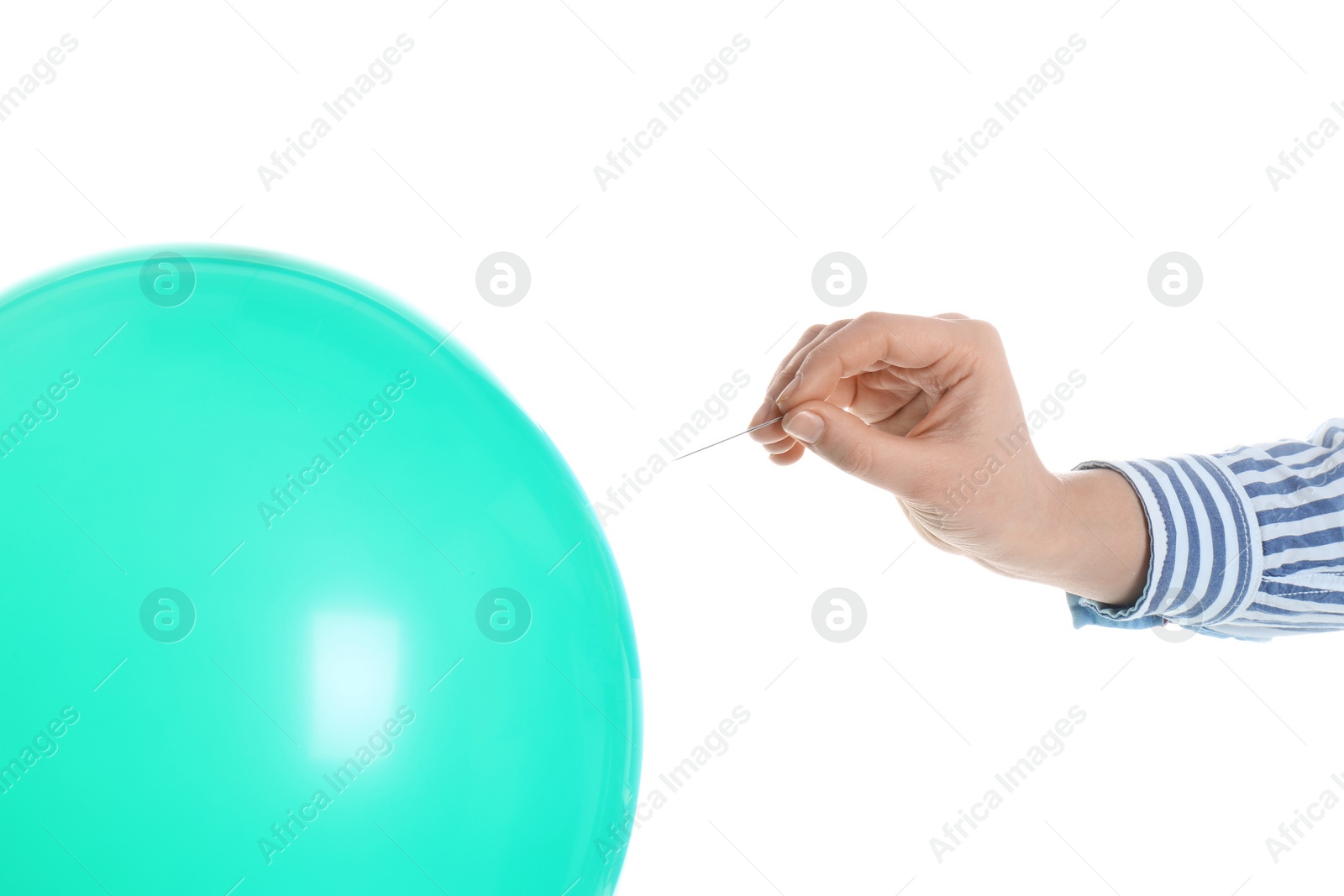 Photo of Woman piercing green balloon on white background, closeup