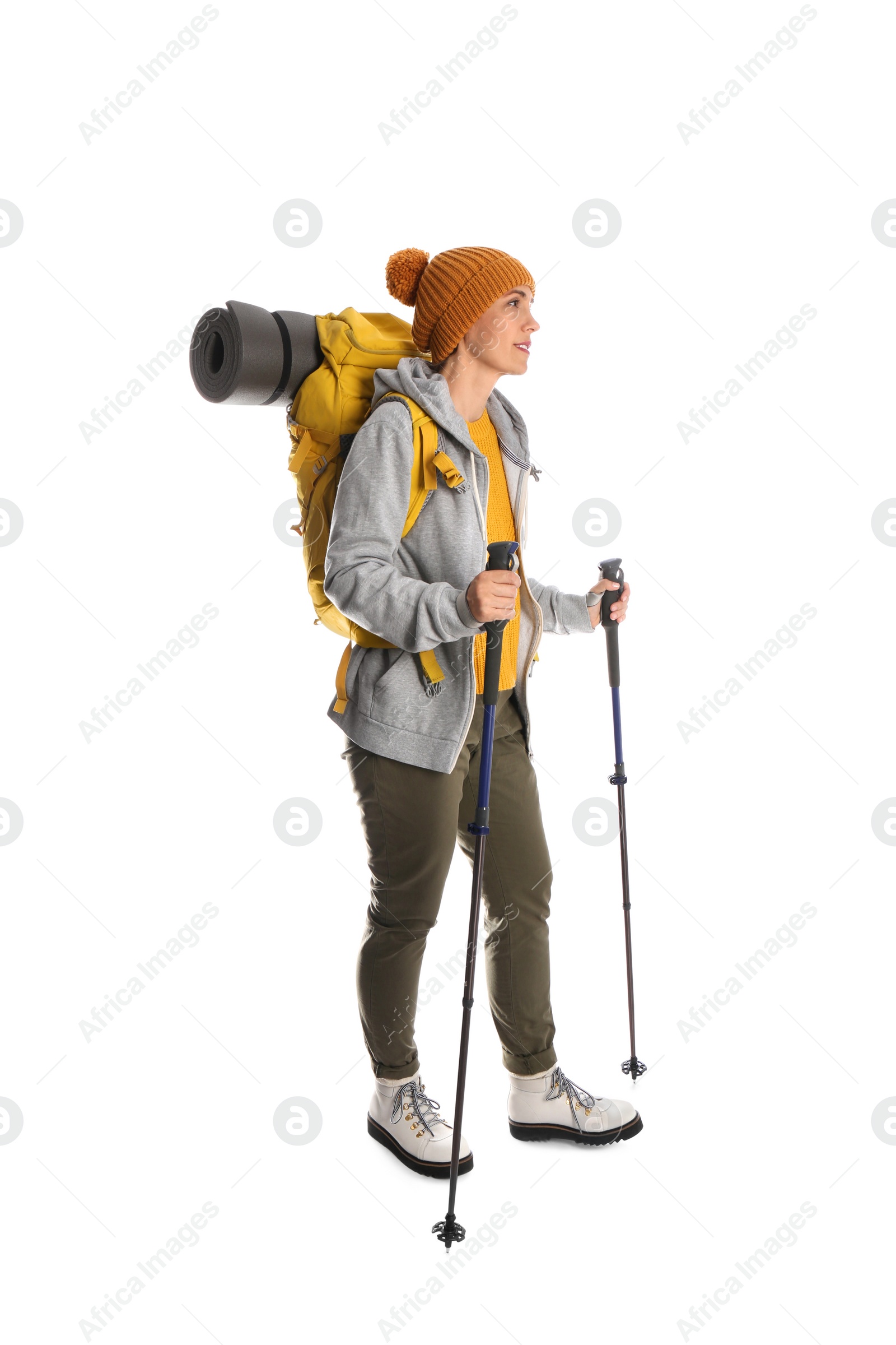 Photo of Female hiker with backpack and trekking poles on white background