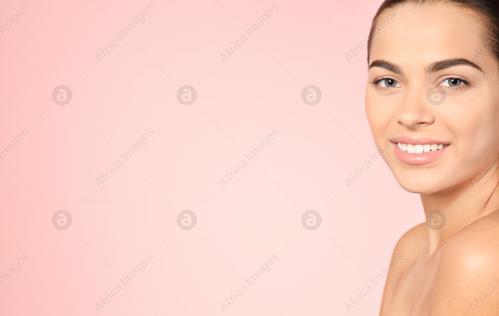 Photo of Portrait of beautiful young woman and space for text on color background. Cosmetic surgery concept