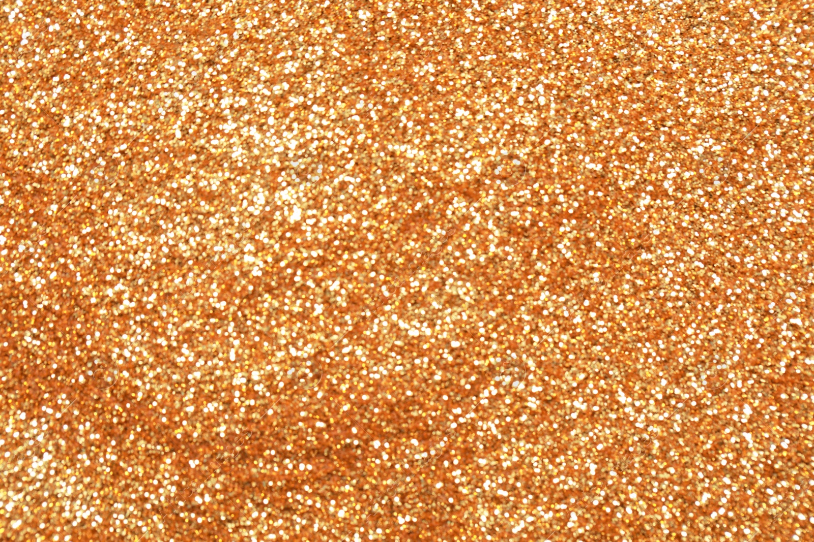 Photo of Beautiful golden shiny glitter as background, top view